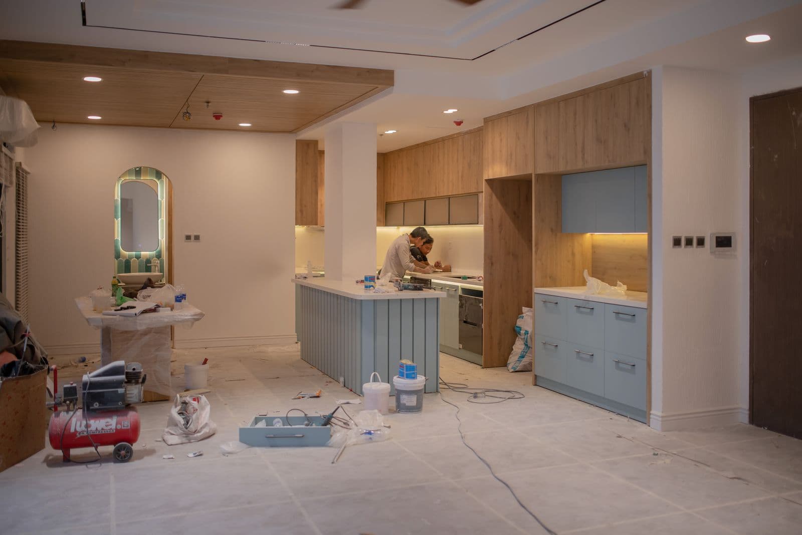 Kitchen under renovation with surfaces covered