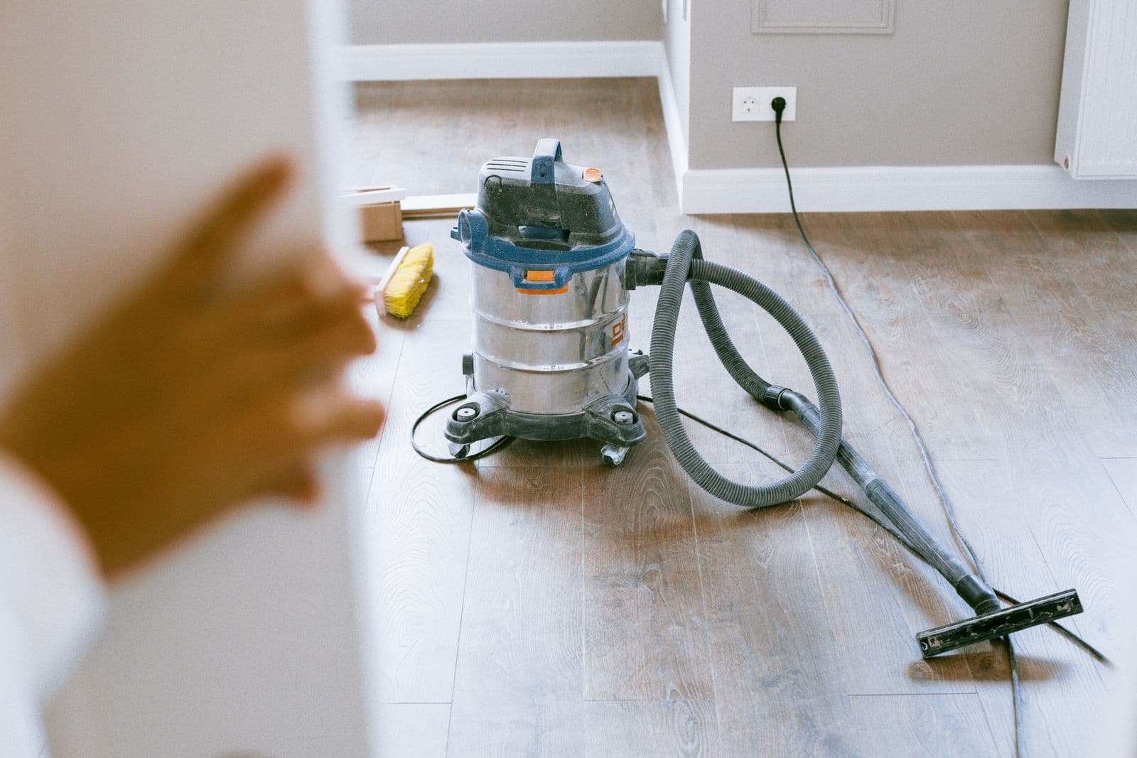 Shop vacuum on the floor of a freshly painted room